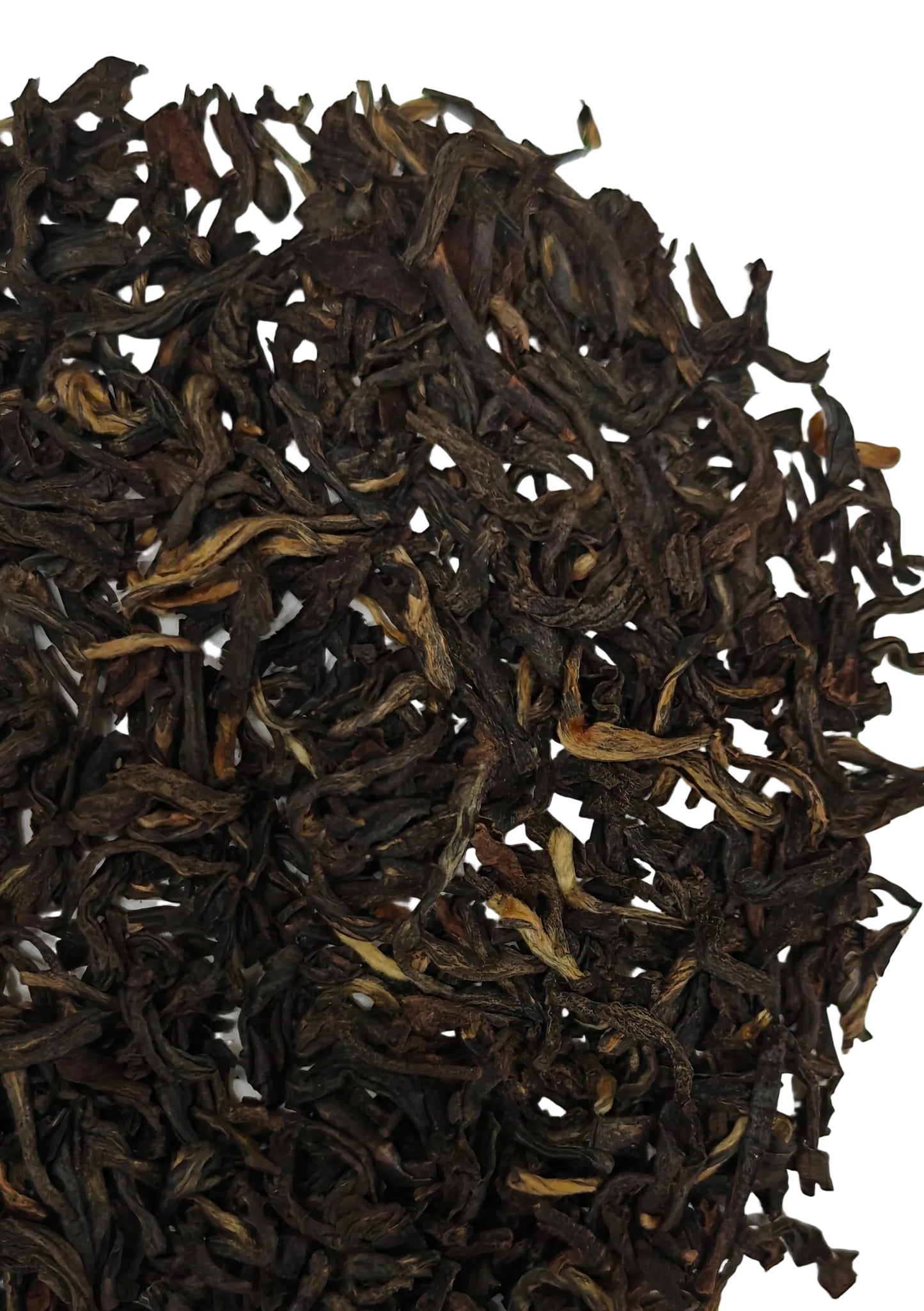 Close-up of dark brown tea leaves on a white background